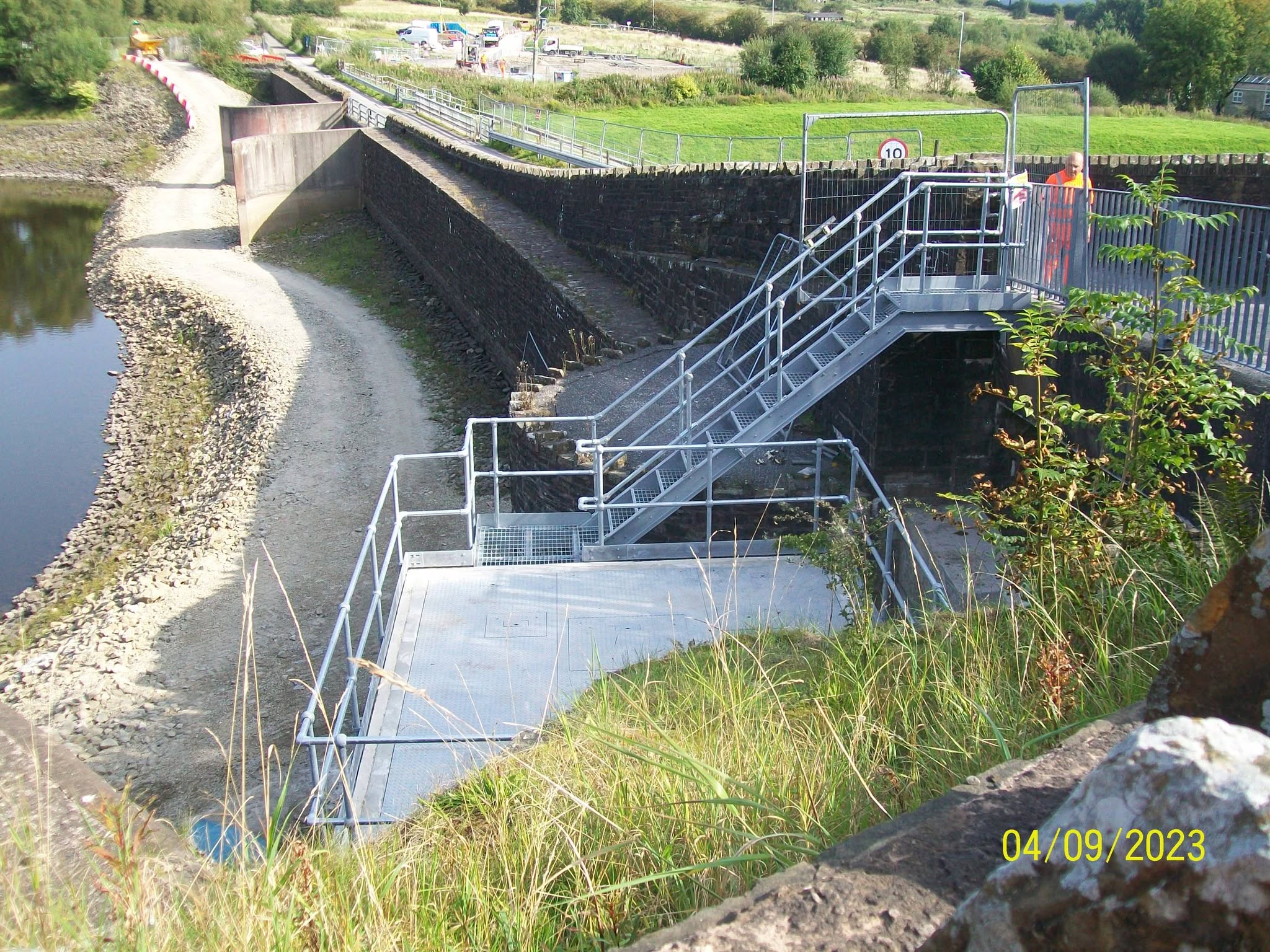 Galvanised steel access platform and stairs at a dam