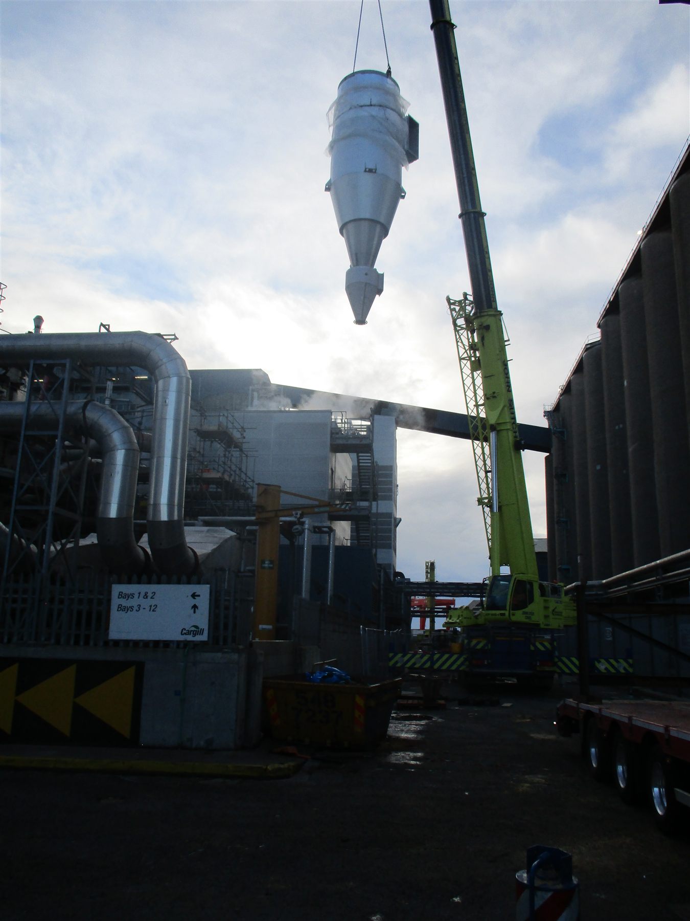 Stainless steel cyclone vessel being craned into position on site
